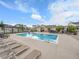 Community pool with lounge chairs and seating areas at 2059 S Vance Way, Denver, CO 80227