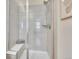 Elegant primary bath featuring glass shower with bench and tiled walls at 2059 S Vance Way, Denver, CO 80227