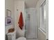 Bright bathroom with a glass door shower, neutral paint, and vanity at 13762 W 67Th Pl, Arvada, CO 80004