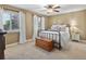 Bright bedroom with a bed, dresser, and natural light at 13762 W 67Th Pl, Arvada, CO 80004