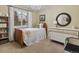 Cozy bedroom with a wooden bed frame, natural light, and dresser at 13762 W 67Th Pl, Arvada, CO 80004