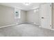 Basement bedroom with soft carpet, neutral colored walls, and natural light at 6913 Teller Ct, Arvada, CO 80003