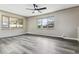 A large bedroom with natural light and new hardwood floors at 6913 Teller Ct, Arvada, CO 80003