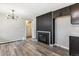 Living room featuring a fireplace, recessed lighting, hardwood floors, and neutral colored walls at 6913 Teller Ct, Arvada, CO 80003