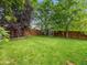 Spacious backyard with a shed and privacy fence, ideal for outdoor activities at 23222 E Orchard Pl, Aurora, CO 80015