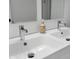 Modern bathroom vanity with double sinks and chrome fixtures at 23222 E Orchard Pl, Aurora, CO 80015