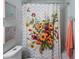 Bright bathroom featuring a floral shower curtain and light-colored walls at 23222 E Orchard Pl, Aurora, CO 80015