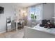 Bedroom featuring hard wood floors, a white desk and chair, a full length mirror, and teddy bears at 23222 E Orchard Pl, Aurora, CO 80015