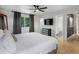 Bedroom featuring neutral decor, view to ensuite bath and ceiling fan at 23222 E Orchard Pl, Aurora, CO 80015