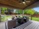 Covered patio area with outdoor furniture and ceiling fan overlooking backyard at 23222 E Orchard Pl, Aurora, CO 80015