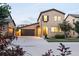 Inviting two-story home featuring a spacious driveway and attached two-car garage at 2592 S Norse Ct, Lakewood, CO 80228