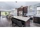 Modern kitchen featuring stainless steel appliances, granite countertops and a large kitchen island at 2592 S Norse Ct, Lakewood, CO 80228