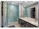 Stunning bathroom boasts double sinks, granite counters, walk-in shower with designer tile and bench at 2592 S Norse Ct, Lakewood, CO 80228