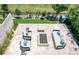 Aerial view of a stamped concrete patio with fire pit, manicured lawn and outdoor seating at 2592 S Norse Ct, Lakewood, CO 80228