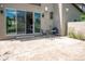 Stamped concrete patio with outdoor seating, grill, and sliding door access to the interior at 2592 S Norse Ct, Lakewood, CO 80228