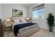 A stunning bedroom with great natural lighting, grey laminate flooring, and elegant decorations at 24501 E 41St Ave, Aurora, CO 80019