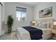 Comfortable bedroom with an accent painting and a window that faces the street at 24501 E 41St Ave, Aurora, CO 80019