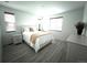 Relaxing bedroom with abundant natural light, two windows, and a comfortable queen-sized bed at 24501 E 41St Ave, Aurora, CO 80019