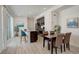 Modern dining area and kitchen with stainless steel appliances at 24501 E 41St Ave, Aurora, CO 80019