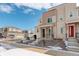 Beautifully landscaped modern townhome with a combination of siding and brick accents on a sunny day at 24501 E 41St Ave, Aurora, CO 80019