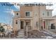 Charming two-story townhome with a combination of brick and siding and a cozy front porch in a Gathering-friendly neighborhood at 24501 E 41St Ave, Aurora, CO 80019