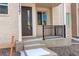 Charming front porch entry with dark front door at 24501 E 41St Ave, Aurora, CO 80019