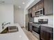 Bright kitchen features stainless steel appliances, gas range and an undermount sink at 24501 E 41St Ave, Aurora, CO 80019