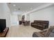 Bright living room featuring hardwood floors and modern furnishings with easy access to the kitchen at 24501 E 41St Ave, Aurora, CO 80019