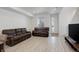 Cozy living room with two comfortable sofas and a view of the front yard at 24501 E 41St Ave, Aurora, CO 80019