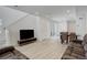 Comfortable living room with media center, open floor plan, and access to the kitchen and dining area at 24501 E 41St Ave, Aurora, CO 80019