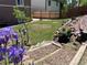 Beautiful backyard with tiered garden and charming wooden steps at 4783 S Taft St, Morrison, CO 80465