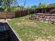 Lovely backyard featuring a patio, tiered garden and privacy fence at 4783 S Taft St, Morrison, CO 80465