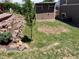 Secluded backyard featuring a tiered garden, privacy fence and storage shed at 4783 S Taft St, Morrison, CO 80465