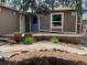 Charming front porch with decorative plants and a welcoming entrance to the home at 4783 S Taft St, Morrison, CO 80465