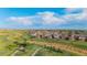 Serene aerial view of a well-planned community surrounded by green spaces and walking paths, providing a tranquil living environment at 19468 E 65Th Pl, Aurora, CO 80019