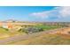 Expansive aerial view showcasing the school, neighborhood, and surrounding landscape, providing a glimpse of community amenities at 19468 E 65Th Pl, Aurora, CO 80019