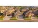 Residential neighborhood with well-kept homes, manicured lawns, and tree-lined streets offering suburban charm at 19468 E 65Th Pl, Aurora, CO 80019