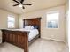 This bedroom boasts a spacious layout, natural light, and room for a large bed and nightstands at 19468 E 65Th Pl, Aurora, CO 80019