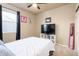 Comfortable secondary bedroom with ceiling fan, carpet, and a large window for natural light at 19468 E 65Th Pl, Aurora, CO 80019