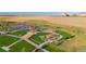 Beautiful aerial view of a well-maintained playground with modern equipment, nestled in a lush, green community, encouraging outdoor activity at 19468 E 65Th Pl, Aurora, CO 80019