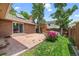 Cozy backyard features a concrete patio, lush lawn, mature trees, and flower garden at 37 E 14Th Pl, Broomfield, CO 80020