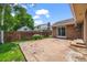 Backyard with a concrete patio, lawn, and wooden fence, ideal for outdoor activities at 37 E 14Th Pl, Broomfield, CO 80020
