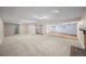 Partially finished basement featuring carpeted and laminate flooring and bright recessed lighting at 37 E 14Th Pl, Broomfield, CO 80020