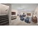 Beautiful basement living area features comfortable seating, a fireplace, and a modern entertainment center at 37 E 14Th Pl, Broomfield, CO 80020