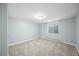 This bedroom is carpeted and has light-colored walls, as well as a window for natural light at 37 E 14Th Pl, Broomfield, CO 80020