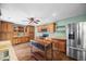 This kitchen features wood cabinets, granite countertops, stainless steel appliances, and a wooden island at 37 E 14Th Pl, Broomfield, CO 80020