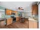 This updated kitchen boasts granite countertops, wood cabinets, stainless steel appliances and wood-look tile flooring at 37 E 14Th Pl, Broomfield, CO 80020