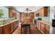 Spacious kitchen with an island, wood-look floors, and extensive cabinetry at 37 E 14Th Pl, Broomfield, CO 80020