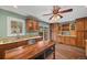 Kitchen featuring granite countertops, wooden cabinetry, stainless appliances, and a backyard view at 37 E 14Th Pl, Broomfield, CO 80020