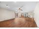 Spacious living room showcasing wood floors and access to kitchen and backyard at 37 E 14Th Pl, Broomfield, CO 80020